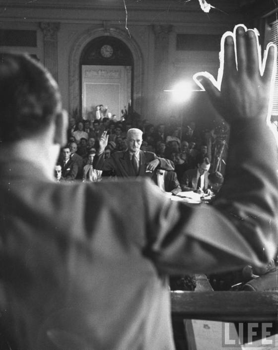 Joseph McCarthy swearing in author Dashiell Hammett at Senate Permanent Investigating Committee hearing on Communism. Hammett is suspected of being a communist..Washington, DC, US1953Hank Walker